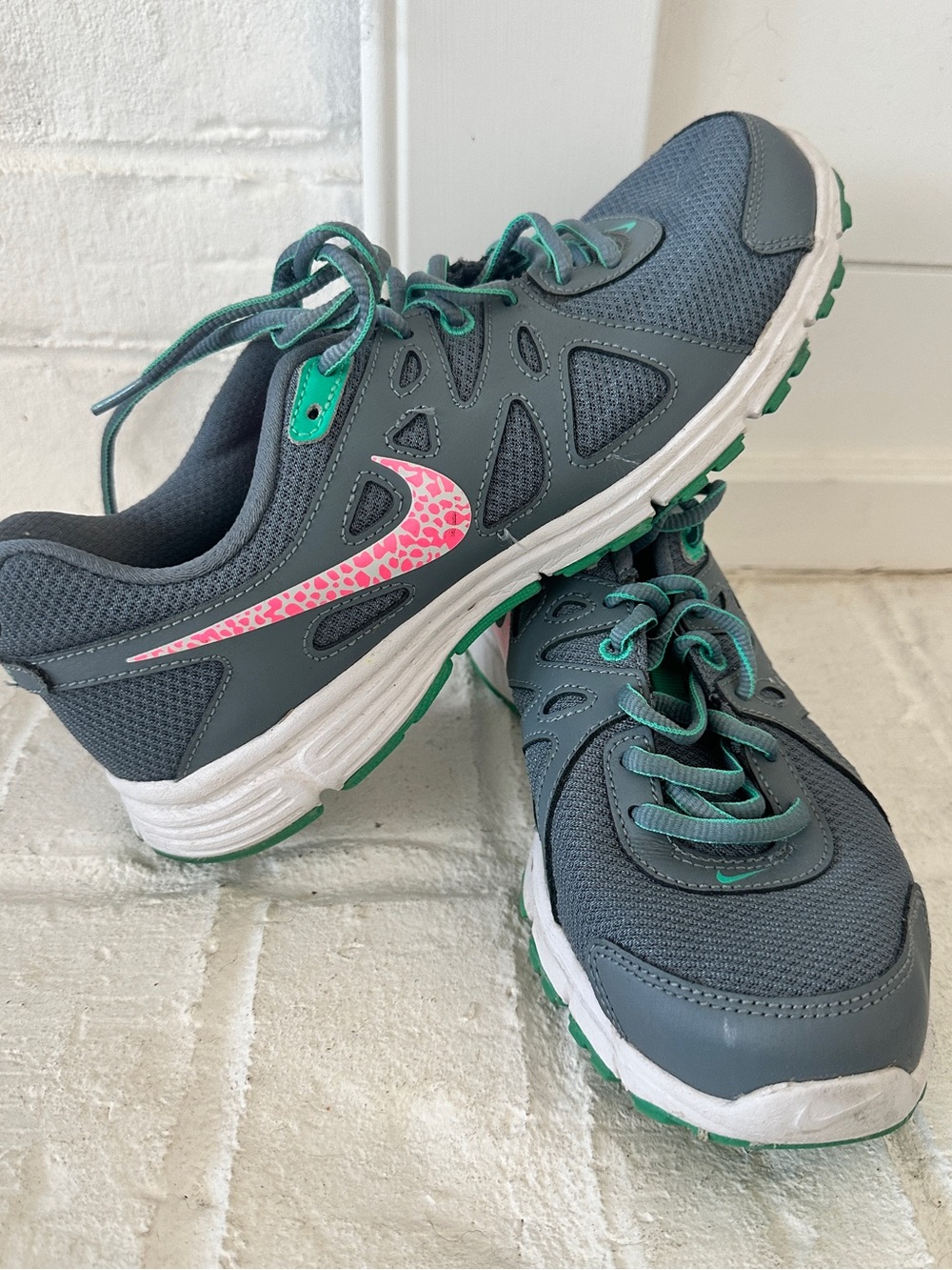 Nike Women’s Gray Athletic Sneakers with Pink Swoosh and Green Accents